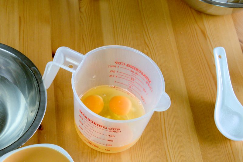 Crack the eggs into a measuring cup