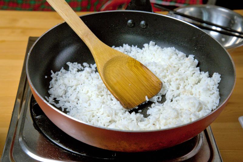 Use a nonstick pan or skillet to fry the rice