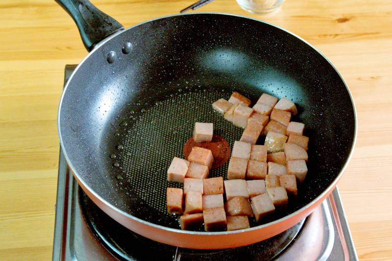 pan-fry the luncheon meat until they are slightly crispy on the outside.