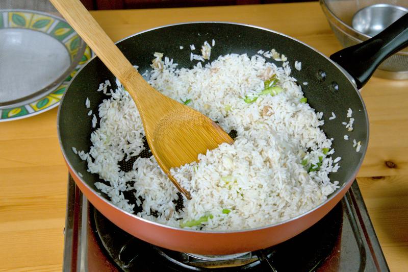 fry the uncooked rice